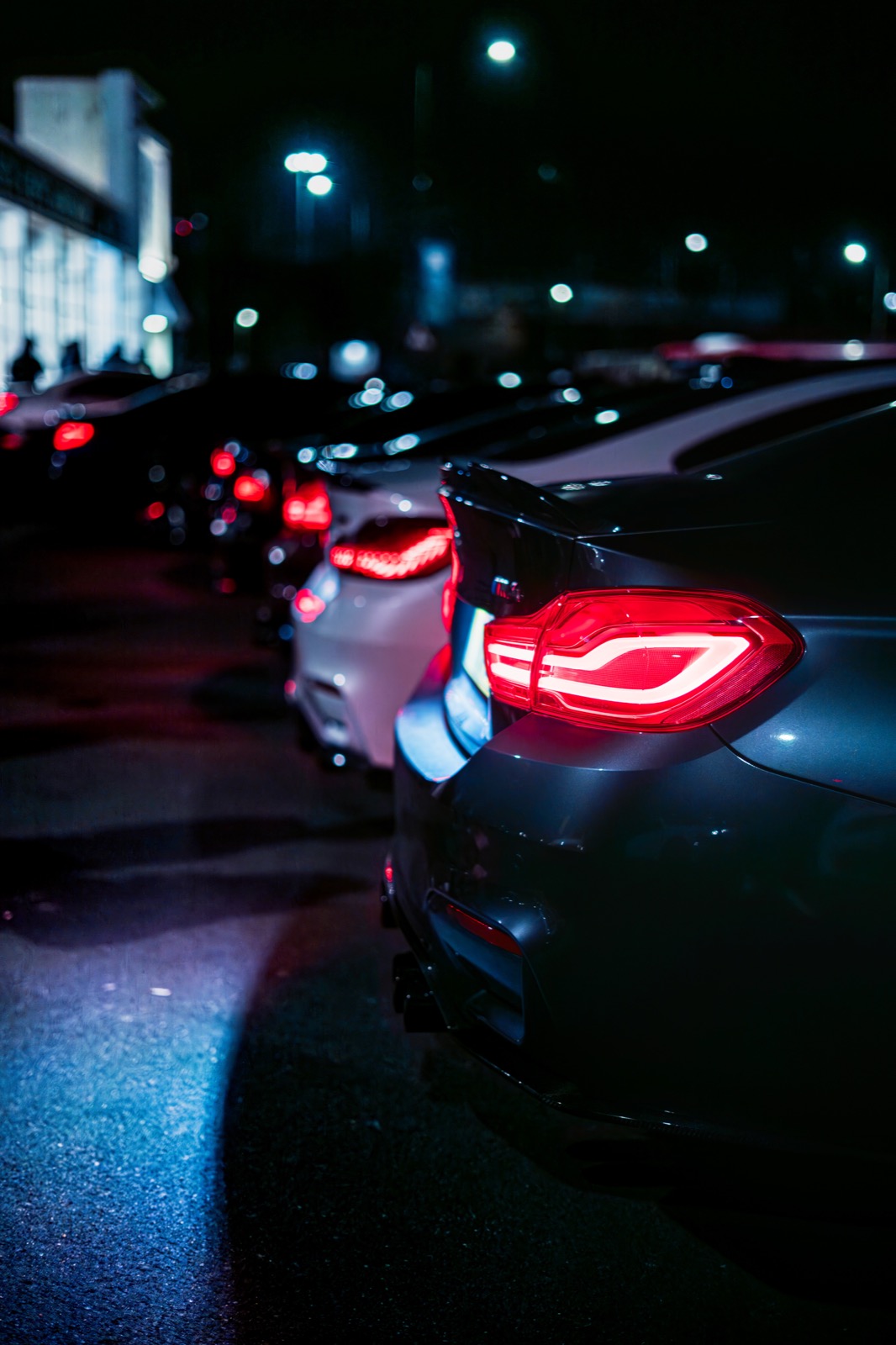 Cars lined up at a night meet